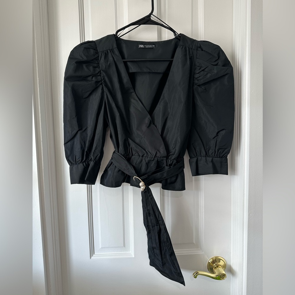 Black top with pearl belt detail size medium